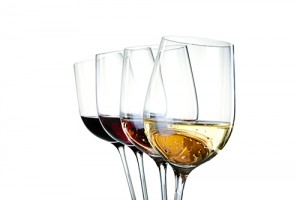 Four wineglasses with different colors of wine